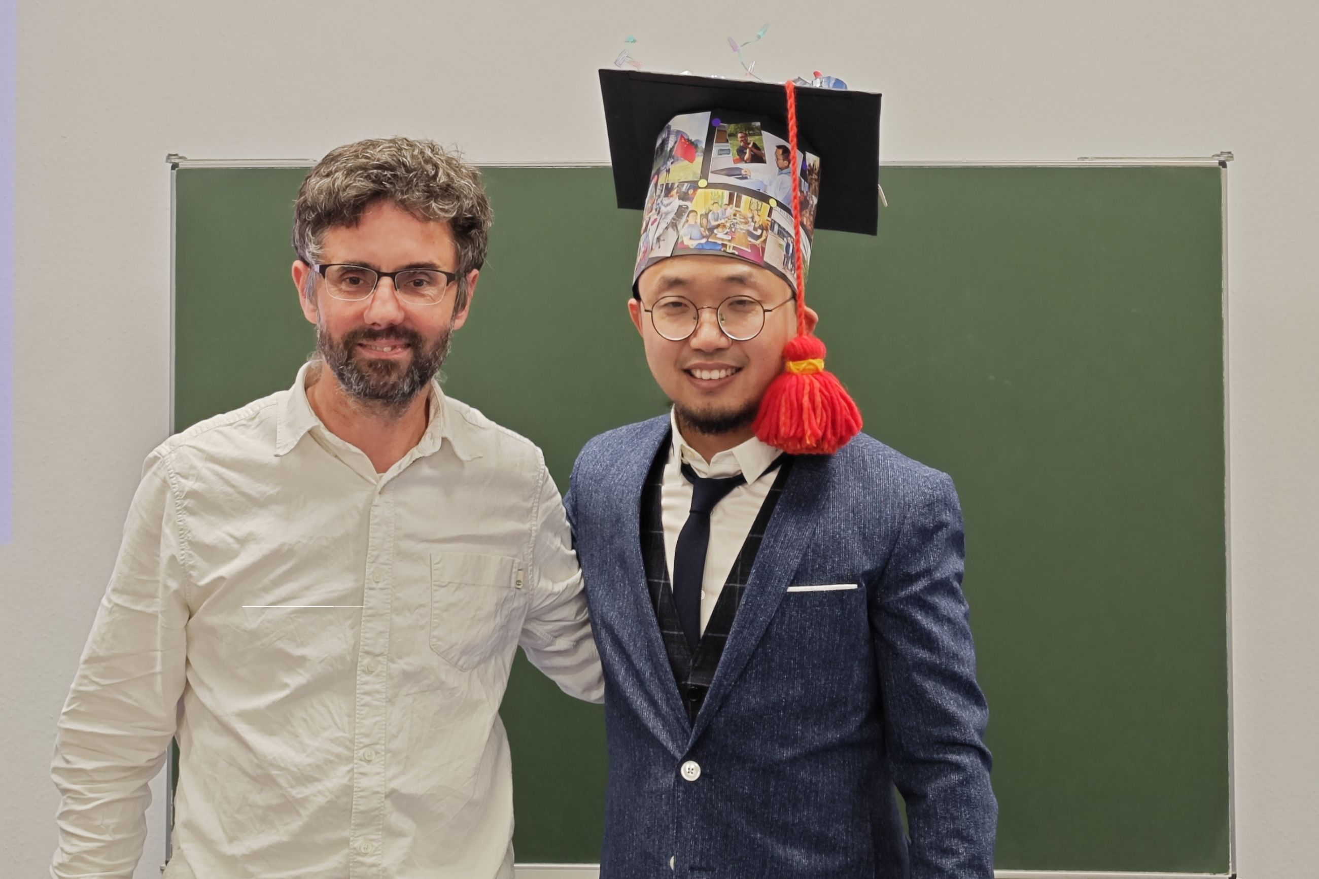The successful former PhD candidate Dr Peng after his defense (left) with supervisor Wigge. Photo: W. Zeng